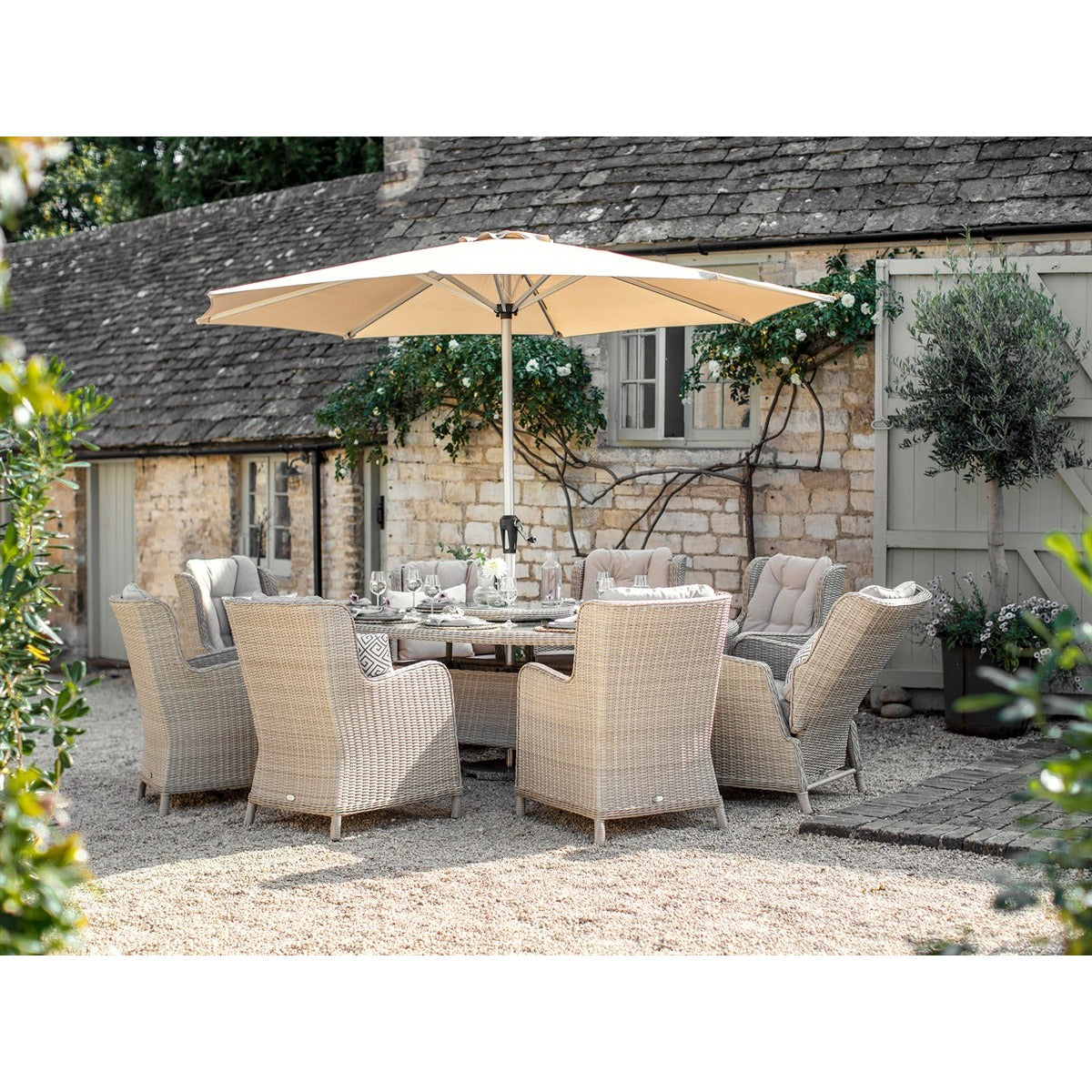 Sandstone Rattan 8 Seat Elliptical Dining Set (including 2 Recliners) with Lazy Susan, Parasol & Basegarden